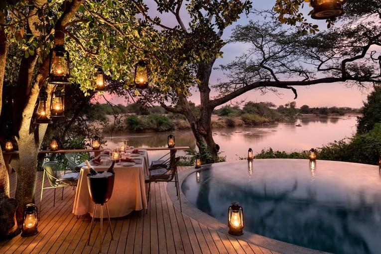 &Beyond Grumeti Serengeti River Lodge Tanzania-Grumeti-Serengeti-River-Lodge-Experiences-Guest-Delight-Pool-dinner_3