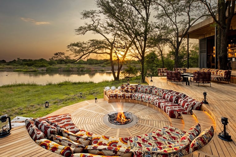 &Beyond Grumeti Serengeti River Lodge Tanzania-Grumeti-Serengeti-River-Lodge-Guest-Area-firepit-with-sunset