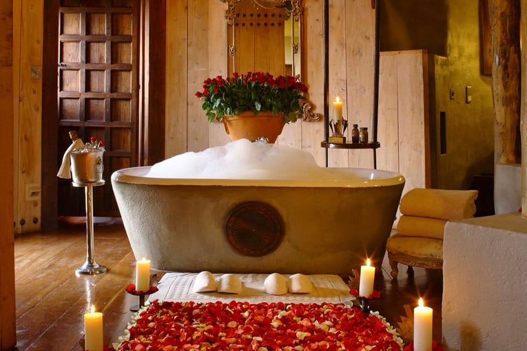 &Beyond Ngorongoro Crater Lodge bathtub-filled-with-bubble-bath-and-rose-petals-at-andbeyond-ngorongoro-crater-lodge-on-a-luxury-safari-in-tanzania