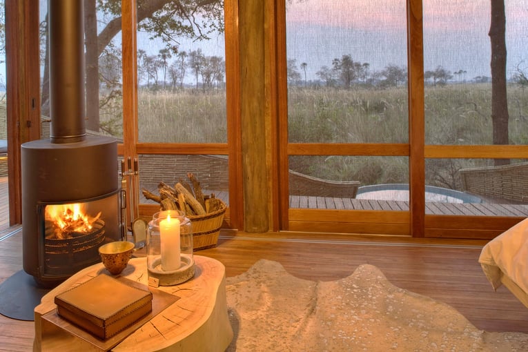 &Beyond Sandibe Okavango Safari Lodge elegant-suite-dining-at-andBeyond-sandibe-on-a-luxury-botswana-safari-overlooking-the-okavango-delta