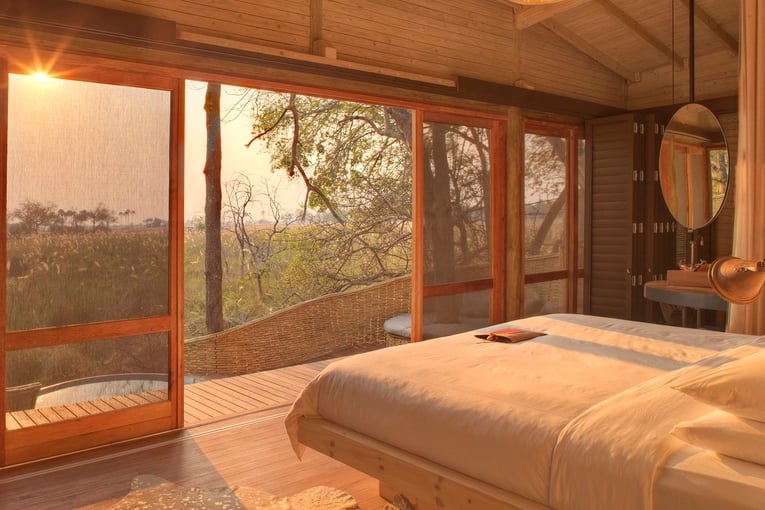 &Beyond Sandibe Okavango Safari Lodge intimate-suites-at-andBeyond-sandibe-elevated-above-the-landscape-feauturing-the-okavango-delta