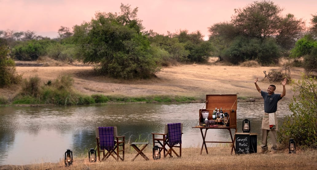 1032x554 &Beyond Grumeti Serengeti River Lodge Tanzania-Grumeti-Serengeti-River-Lodge-Experiences-Guest-Delight-Martini-bar-andBeyonder-butler_4