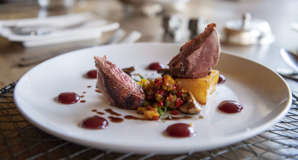 1032x554_Safari_Lodge_Jabulani_Jabulani-Dining-Pan-Fried-duck-Breast-with-potato-fondant-cranberry-jelly-ratatouille-vegetables-young-spinach-baby-gem-squash-and-rosemary-jus-Alex-1-scaled