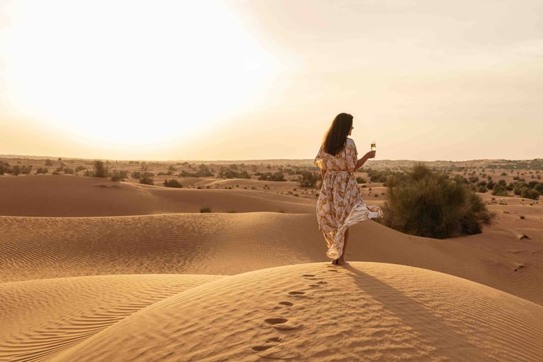 Al Maha Desert Resort lc-dxbam-woman-in-sand-dunes-10308_Classic-Hor
