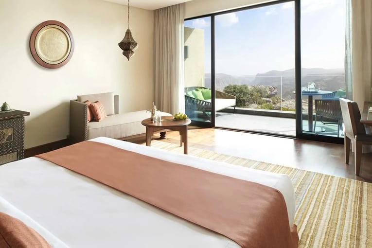 Anantara Al Jabal Al Akhdar anantara_al_jabal_al_akhdar_deluxe_canyon_view_bedroom_01_1920x1037