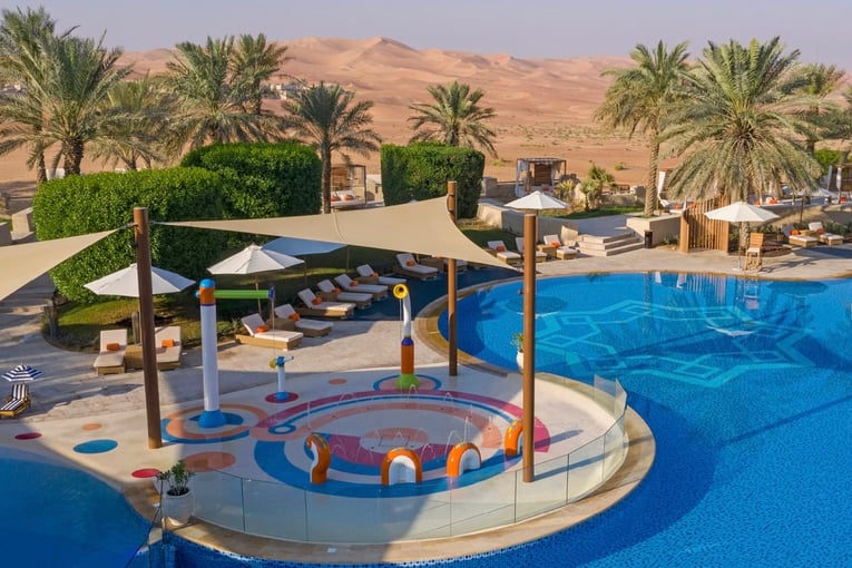 Anantara Qasr al Sarab qasr_al_sarab_desert_resort_by_anantara_pool_view_kids_area_splash_pad_1920x1037
