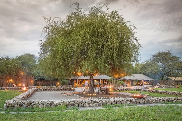 Chem Chem 63495747c486e2171bedba73_Little-Chem-Chem-Safari-Tanzania-Accommodation-Tented-Camp-Main-Area-Evening-Lanterns-Dinner