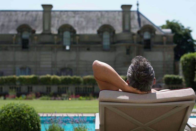 Cliveden House man-relaxing-by-cliveden-spa-swimming-pool-1