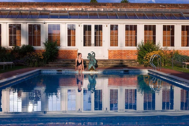 Cliveden House woman-relaxing-by-cliveden-spa-swimming-pool-1