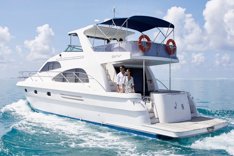 Conrad Maldives couple-on-boat-rear-1063x614