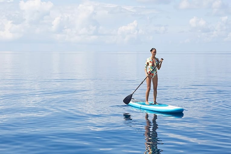 Conrad Maldives woman-paddle-boarding-1063x614