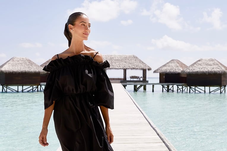 Conrad Maldives woman-walking-from-spa-1063x614