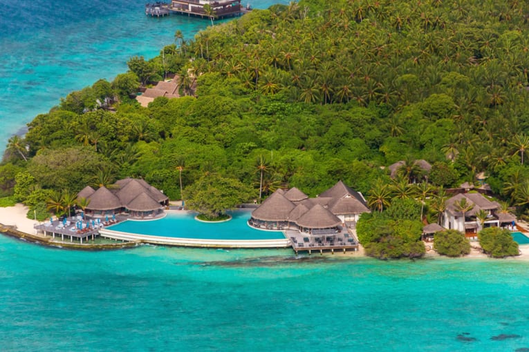 Dusit Thani Maldives dusit-thani-maldives-exterior-indian-ocean-shore-island-trees-pool