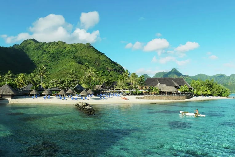 Hilton Moorea Lagoon Resort resort-beach-with-canoe