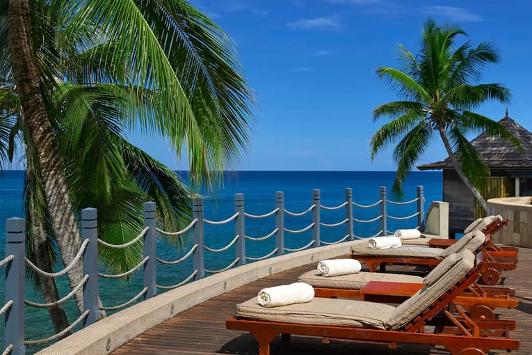 Hilton Seychelles Northolme Resort & Spa swimming-pool-lounge-chairs
